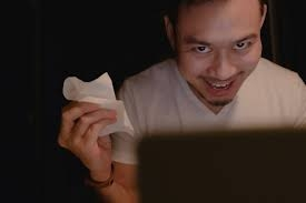 Premium Photo | Funny horny face of asian man watching porn at night.