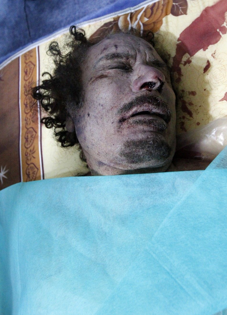 177108-muammar-gaddafi-killed-dead-body-photos-released.jpg