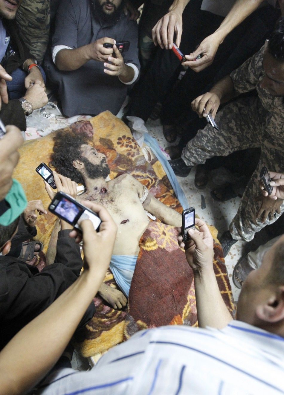 177110-muammar-gaddafi-killed-dead-body-photos-released.jpg