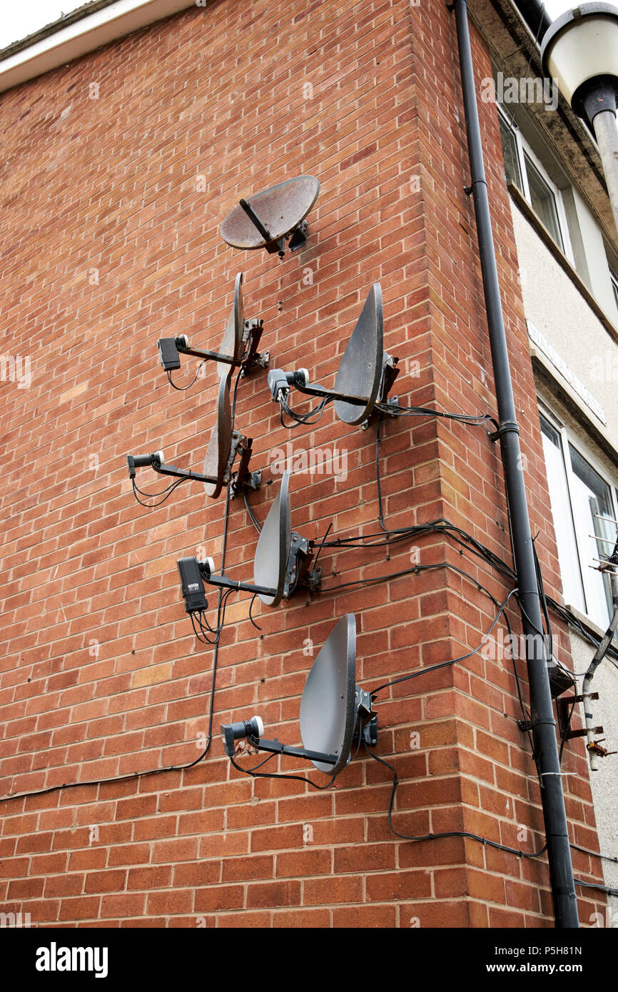 array-of-old-and-new-satellite-television-receiver-dishes-on-the-wall-of-an-apartment-block-of...jpg