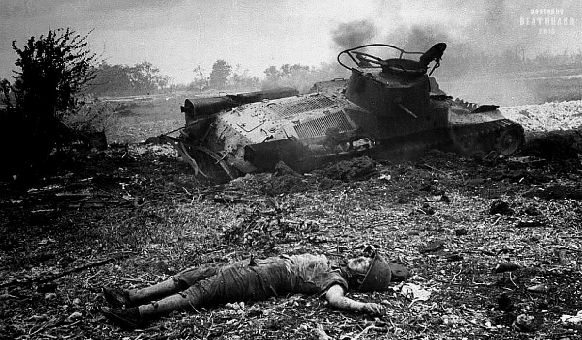 dead Japanese soldier beside wrecked Type 97 Chi Ha tank, Saipan 1944..jpg