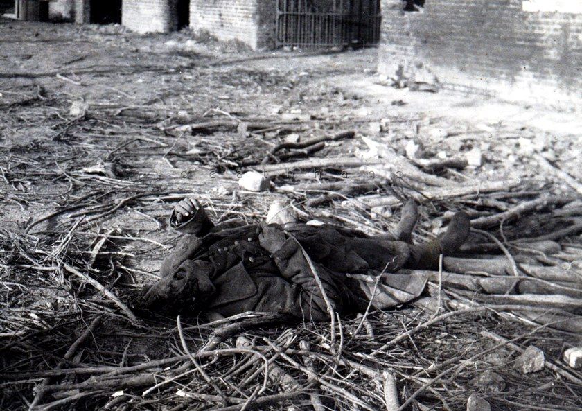 dead-soldier-w-head-shot-and-looted-boots.jpg