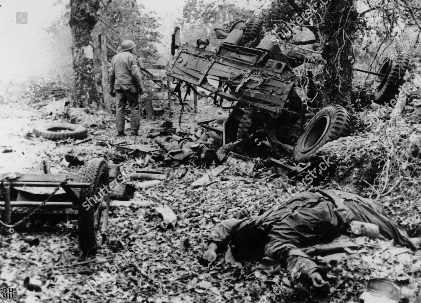 DH - Dead US Soldiers 32 - Killed in combat by German mortar shells, are sprawled across the g...jpg