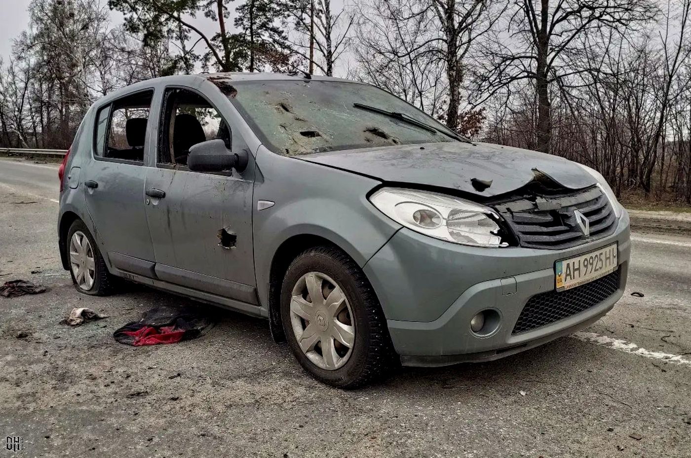 DH - Russians shoot woman dead in car with BMP fire 1 - near Bucha - Apr 2022.jpg
