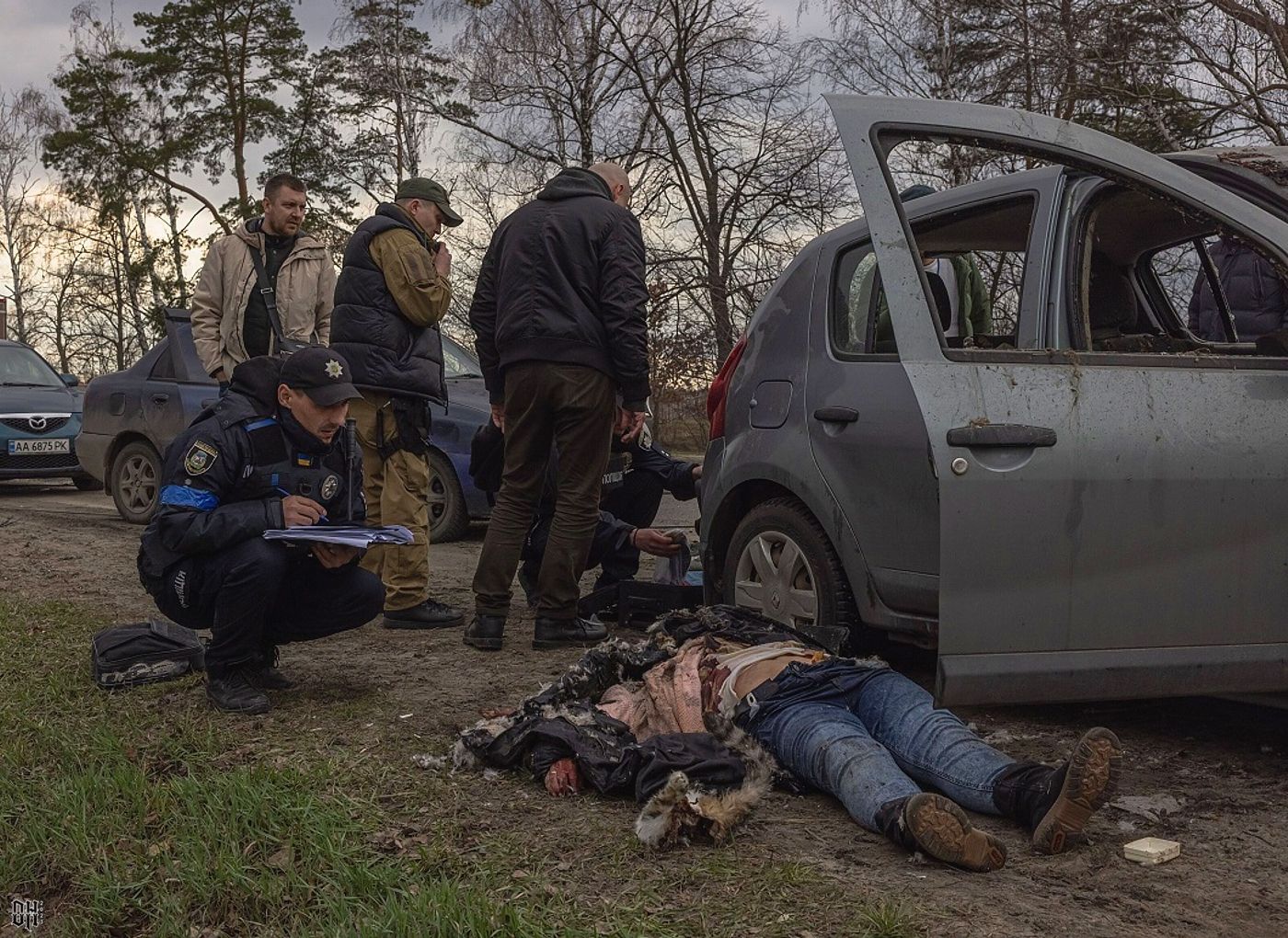 DH - Russians shoot woman dead in car with BMP fire 11 - near Bucha - Apr 2022.jpg