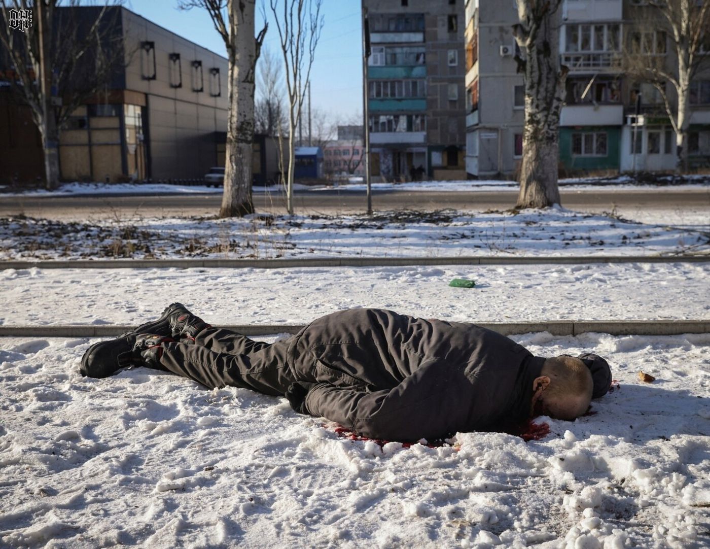 DH - Ukraine~Russia conflict - 1612 - resident lies dead in an empty street in the frontline c...jpg