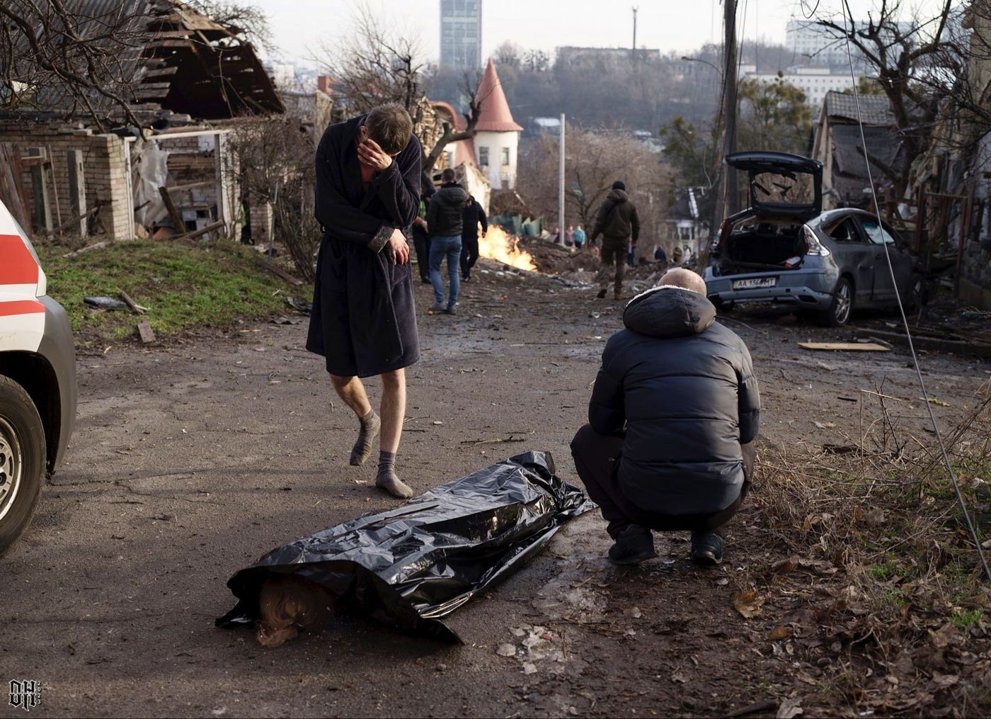 DH - Ukraine~Russia conflict - 1618 - A man cries over the body of his wife, who was shot dead...jpg