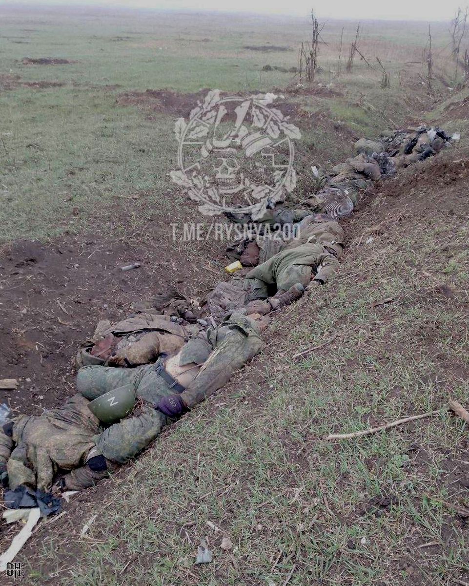 DH - Ukraine~Russia conflict - 1742 - KIA Russian soldiers in trench - March 2023.jpg