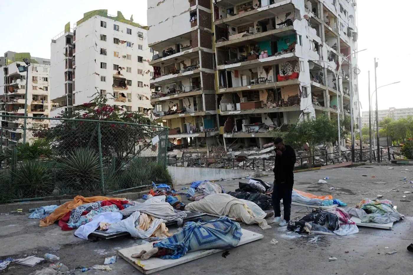 Earthquake aftermath, bodies wrapped in blankets, waiting for collection 2, La Guaira, Venezu...webp