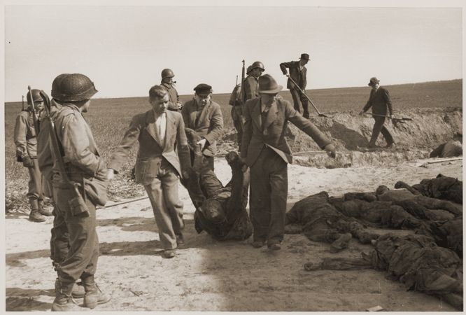 German civilians exhume the bodies of prisoners killed by the SS.jpg