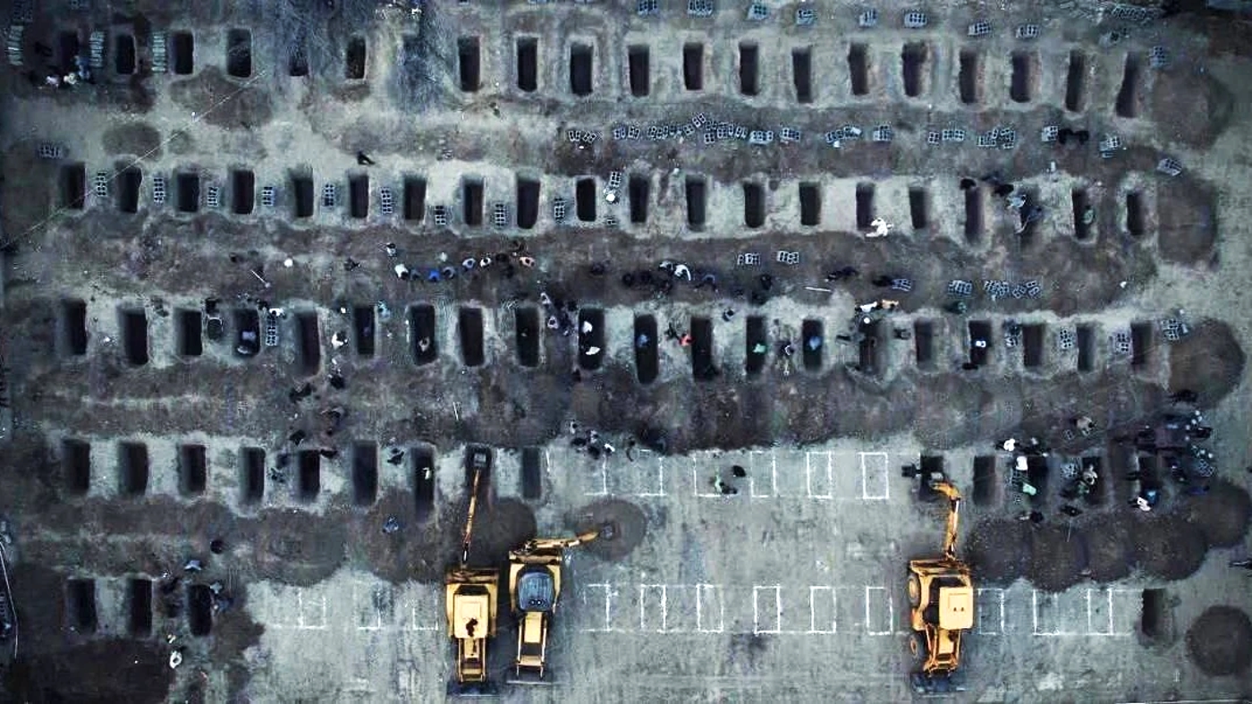 Graves being prepared for the victims, of what Iranian officials said was an Israeli-U.S. str...webp
