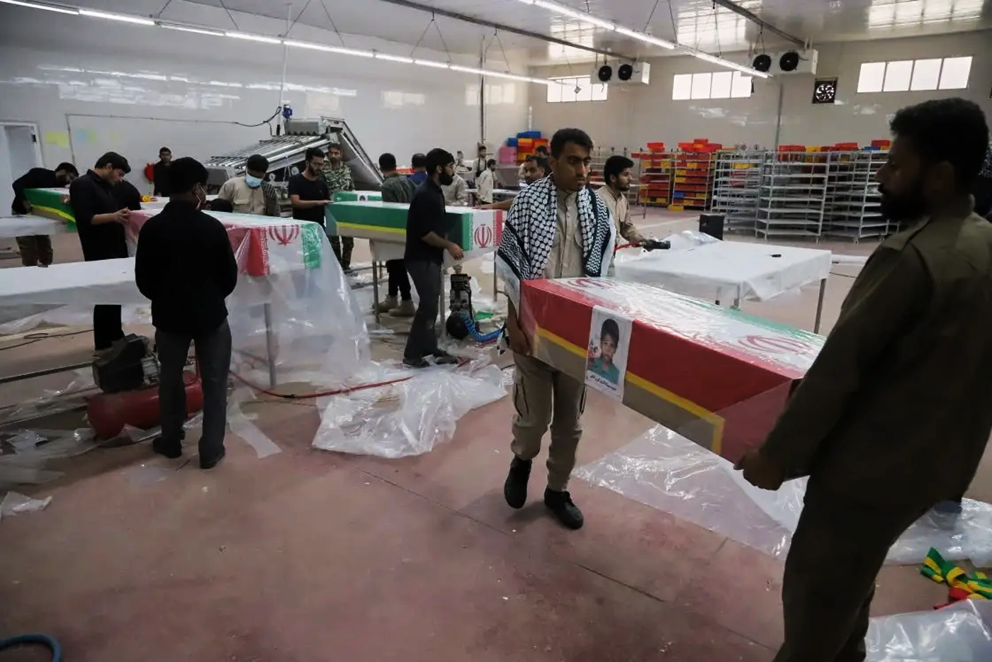 Iranian military prep coffins containing school kids killed in strike on school 2, early Mar ...webp
