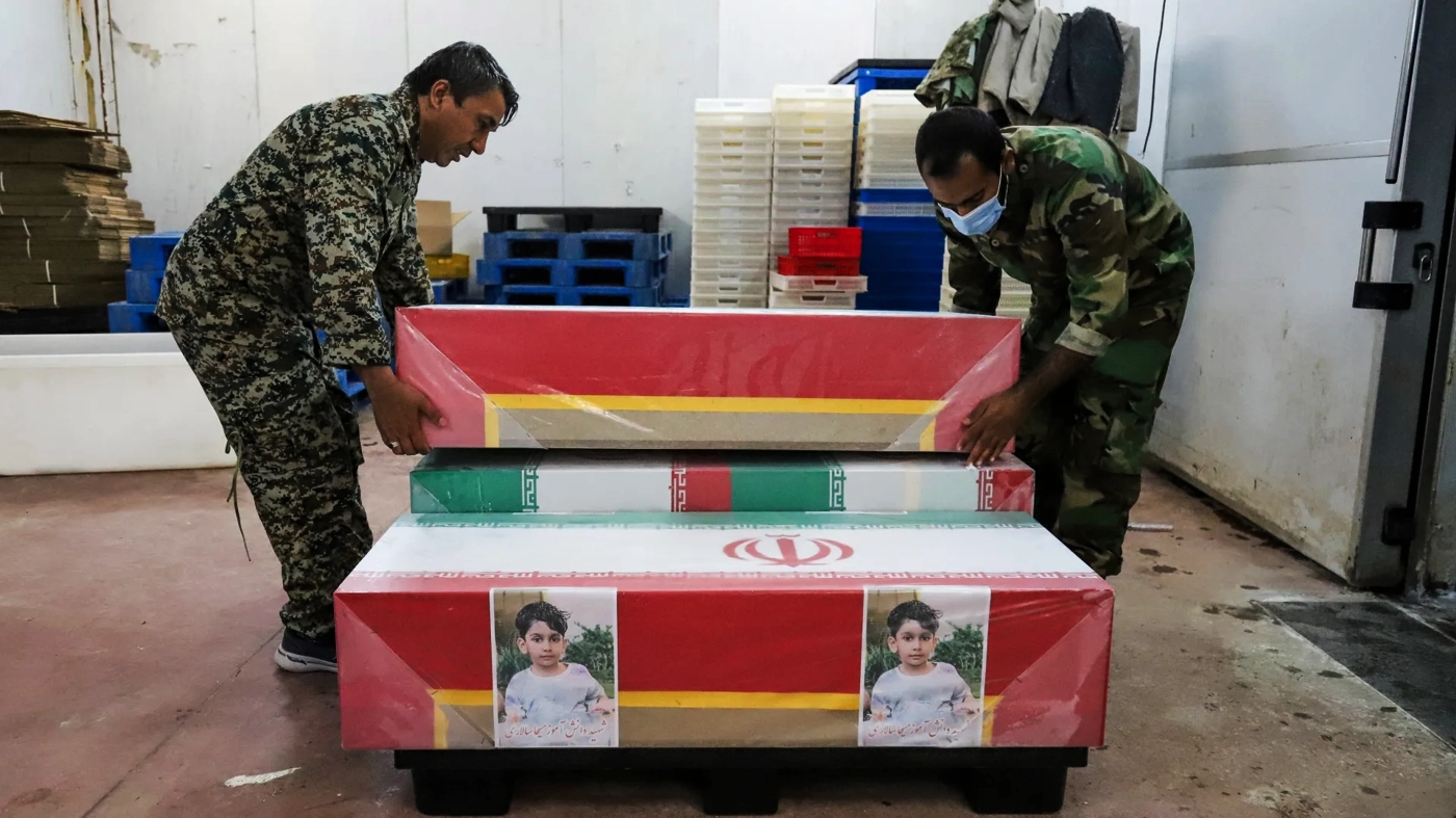 Iranian military prep coffins containing school kids killed in strike on school, early Mar 2026.webp