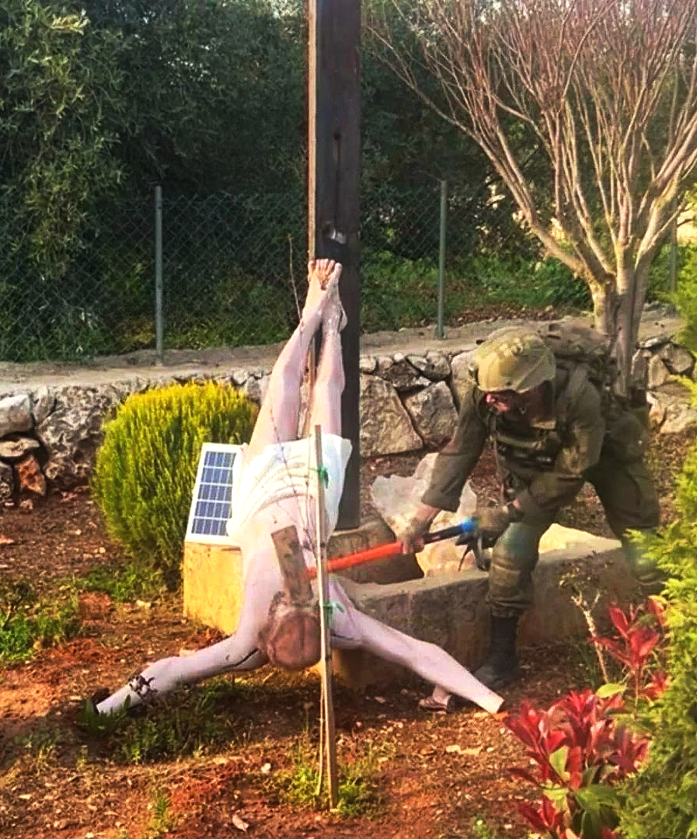 Israeli soldier photographed smashing head of Jesus Christ statue, southern Lebanon, mid Apr ...webp