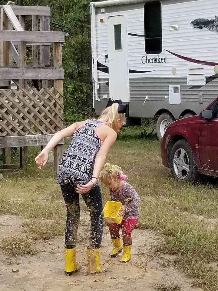 LanieandEmmaleePlayinginMud.webp