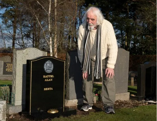 Man Finds Grave at Cementary 3.png