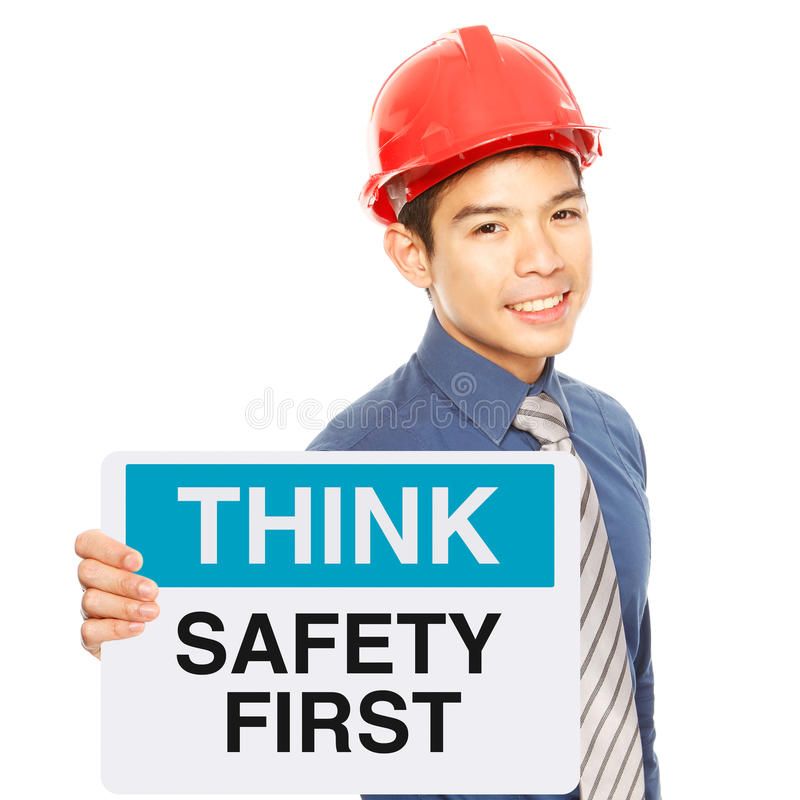 safety-first-man-holding-sign-message-30677653.jpg