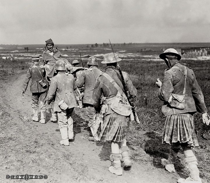 scots-with-german-pows-carrying-wounded-soldier.jpg