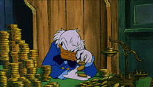 ScroogeMcDuckcountinggoldcoins.gif