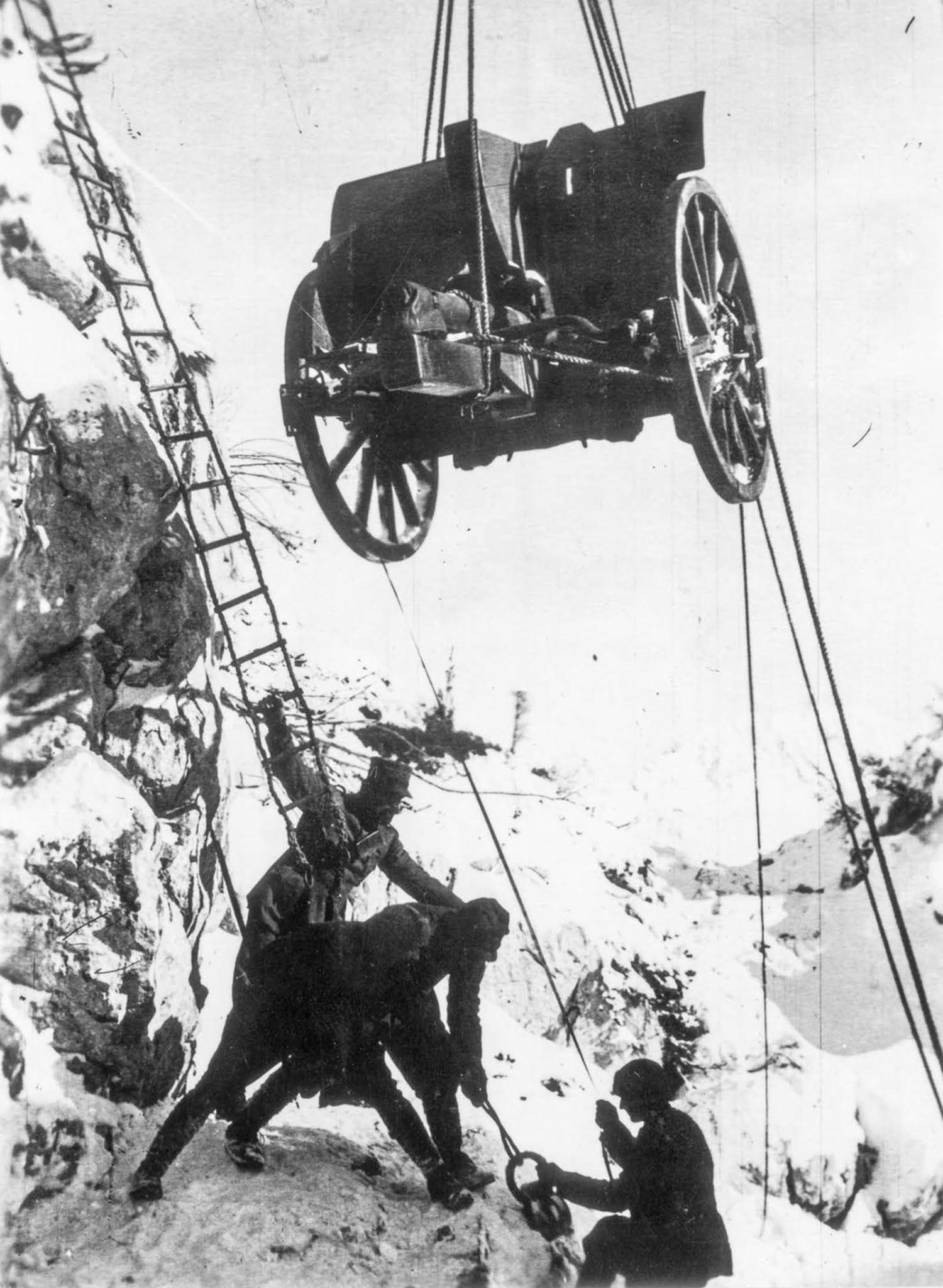 Soldiers hoist a piece of artillery up a cliff, 1917.jpg