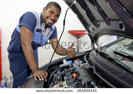 stock-photo-good-looking-mechanic-giving-thumbs-up-and-smiling-265939445.jpg