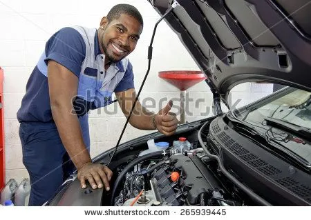 stock-photo-good-looking-mechanic-giving-thumbs-up-and-smiling-265939445.webp