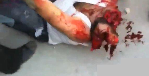 syrian-protester-head-blown-off.jpg