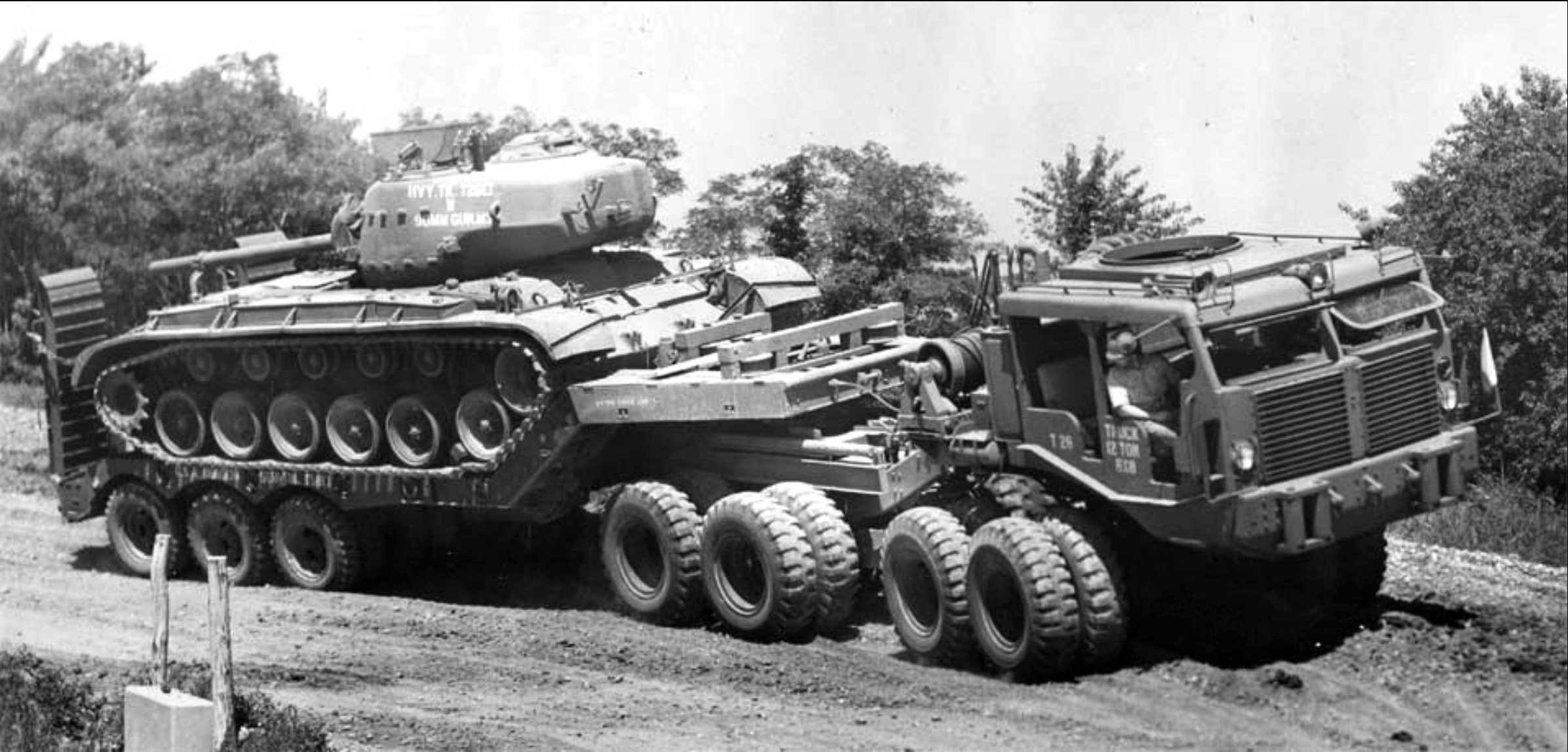US Army Sterling T26 8 x8 12-ton Heavy Truck doing tests pulling a M26 Pershing tank, 1944..png