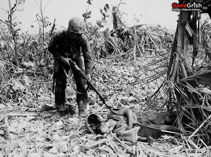 us-marine-checks-dead-japanese-soldier-Perry-Island-1944.jpg