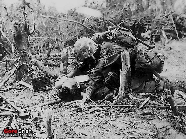 us-marine-gives-water-wounded-buddy-Peleliu-1944.jpg