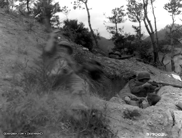 us-medic-dives-into-foxhole-to-help-wounded-Korea-aug2-51.jpg