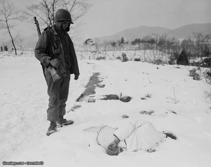 us-soldier-looks-at-bound-dead-civs-Yangii-Korea-jan27-51.jpg