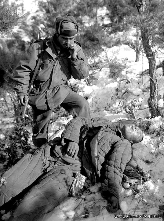 us-soldier-stands-by-dead-chinese-soldier-Korea.jpg