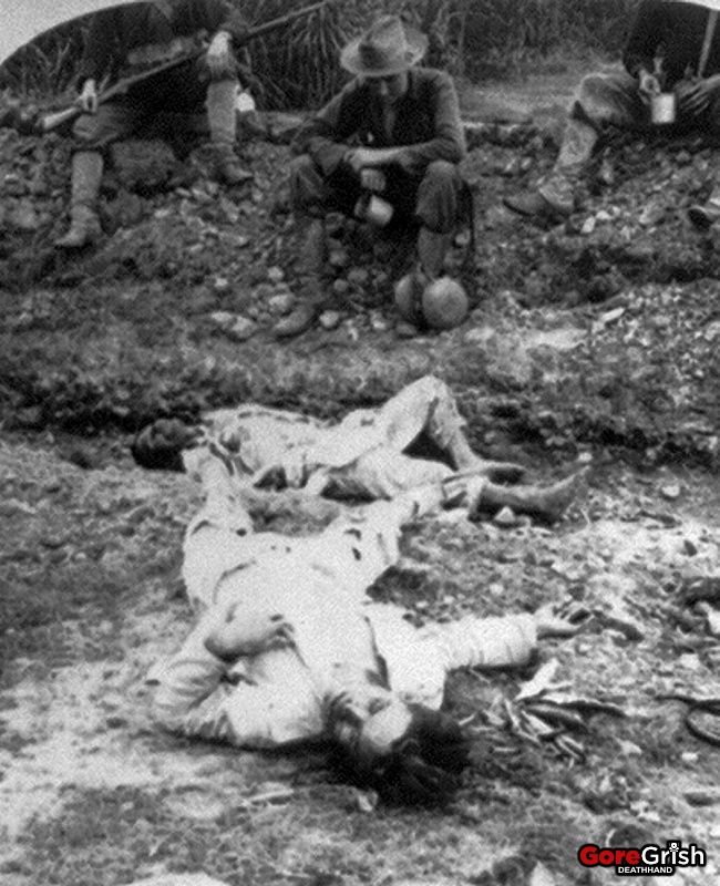 us-troops-rest-beside-dead-filippinos-American-Philippine-War.jpg