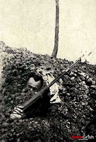 ww1-dead-french-soldier-half-buried.jpg