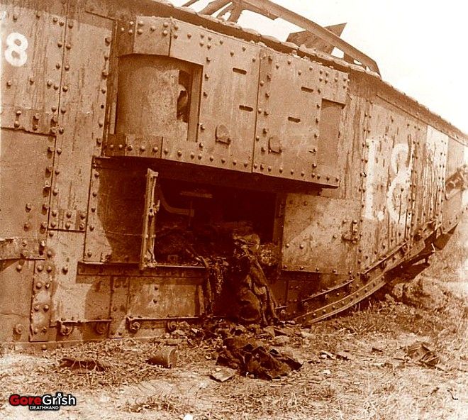 ww1-knocked-out-british-tank-and-crew-remains.jpg