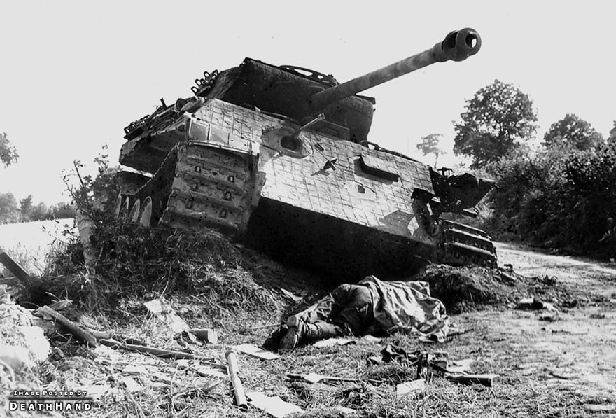ww2-dead-soldier-infront-of-disabled-german-tank.jpg