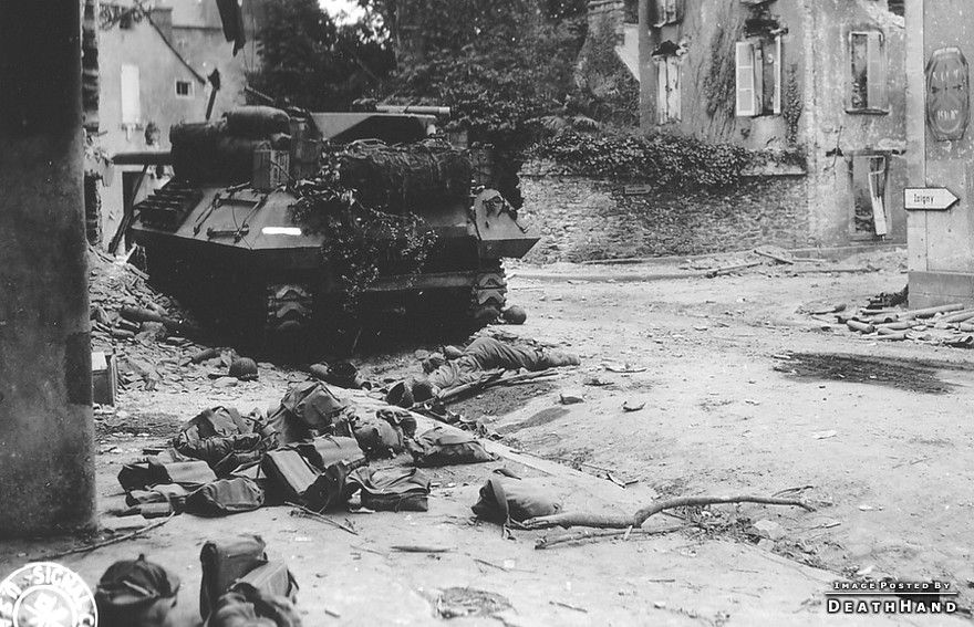 ww2-dead-us-soldier-disabled-us-tank-St-Lo-France-jun25-1944.jpg