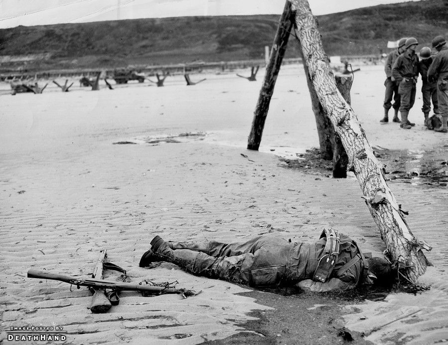 ww2-dead-us-soldier-on-beach1-Vierville-sur-Mer-France-jun7-1944.jpg