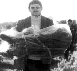 detective-carries-remains.jpg