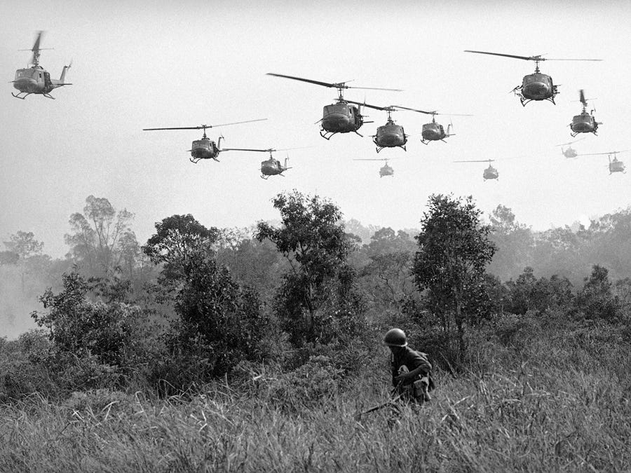 us-army-helicopters-pour-machine-gun-fire-into-the-tree-line-to-cover-the-advance-of-vietnamese-ground-troops-in-an-attack-on-a-viet-cong-camp-on-march-29-1965.jpg